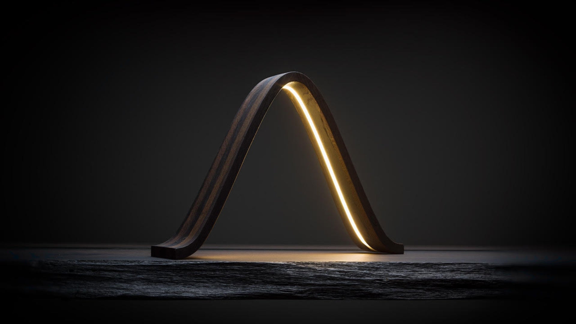 Lamp LAMBDA: A modern light, embedded in wood from thousands of years ago.