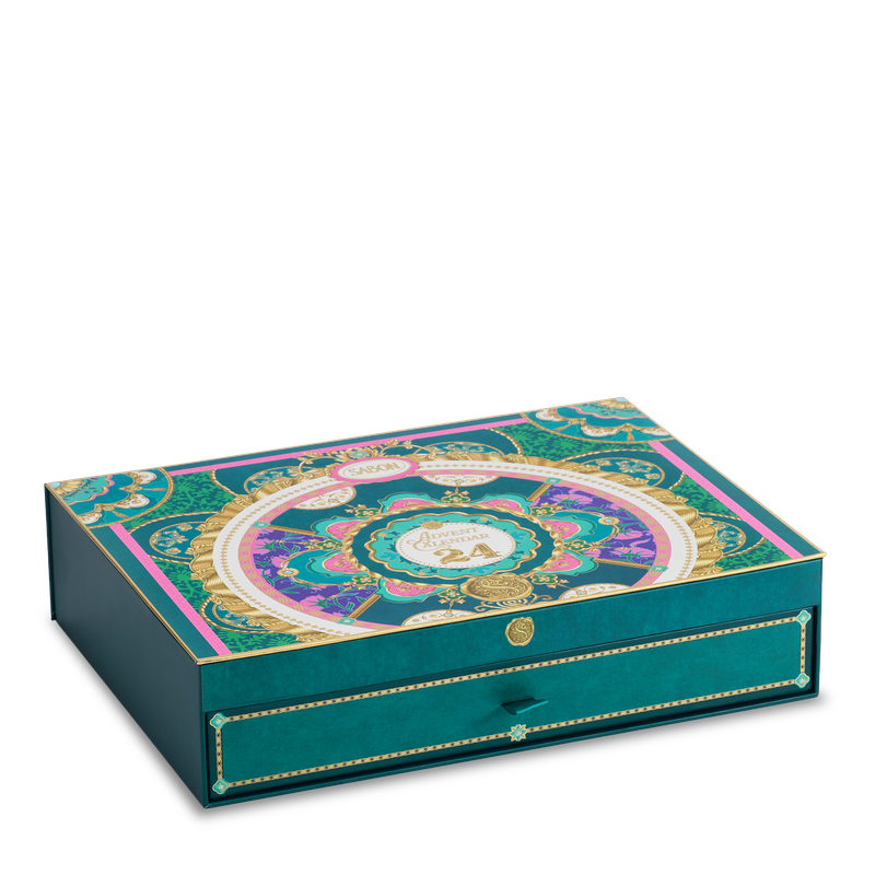Decorative teal box with intricate patterns on a white background