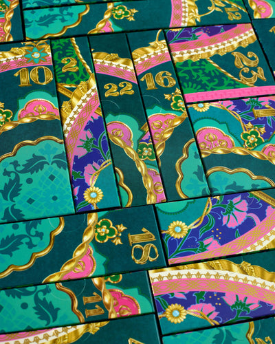 Decorative green boxes with gold and pink designs and numbers.