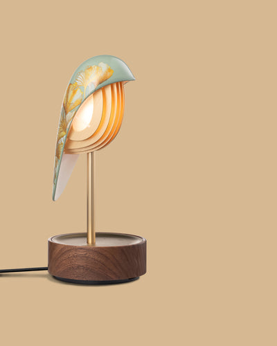 Daqi Alarm clock pale green porcelain bird with gold accents and walnut base wakes up with bird sound works with an app