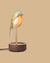 Daqi Alarm clock pale green porcelain bird with gold accents and walnut base wakes up with bird sound works with an app