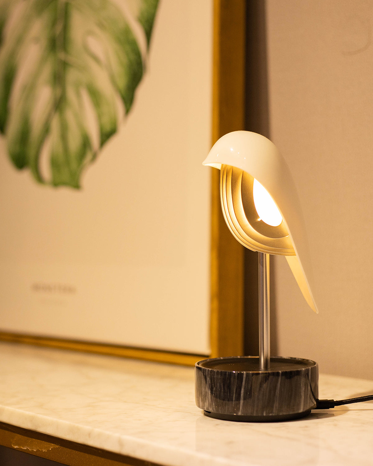 Daqi Alarm clock white porcelain bird with silver accents and black marble base wakes up with bird sound works with an app