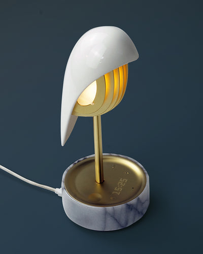 Daqi Alarm clock white porcelain bird with gold accents and white marble base wakes up with bird sound works with an app
