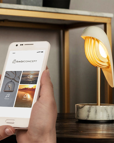 Daqi Alarm clock white porcelain bird with gold accents and white marble base wakes up with bird sound works with an app